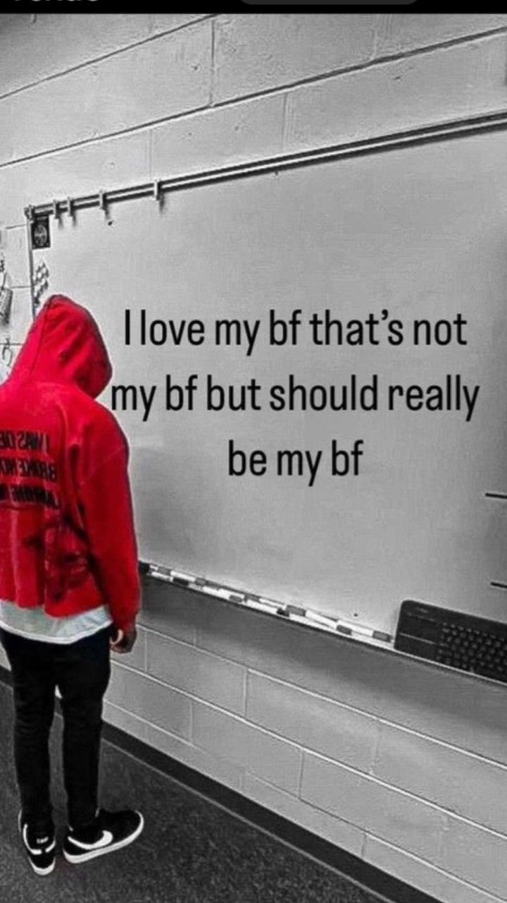 a person in a red jacket writing on a whiteboard with the words i love my btf that's not my but should really be my bt