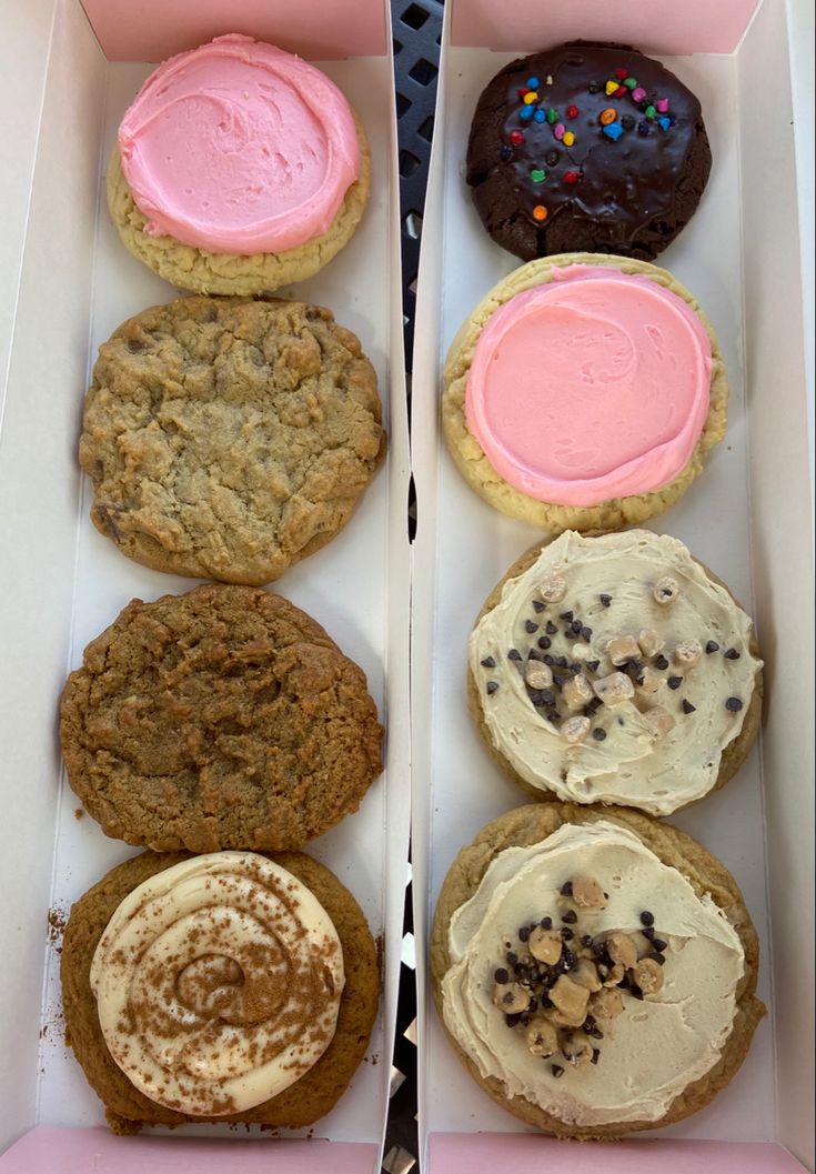 two boxes filled with different types of cookies