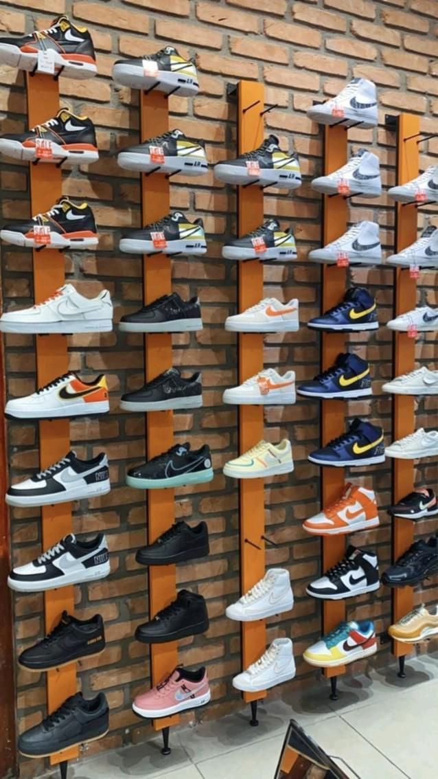 there are many pairs of shoes on display