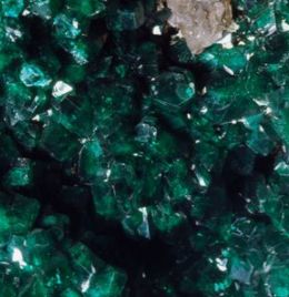 green crystals are piled on top of each other