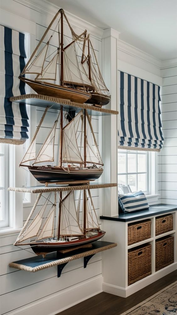 a model ship is on display in a room with blue and white striped curtains,