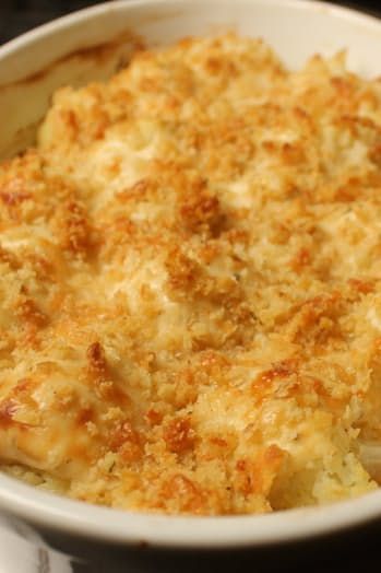 a casserole dish with cheese and bread crumbs