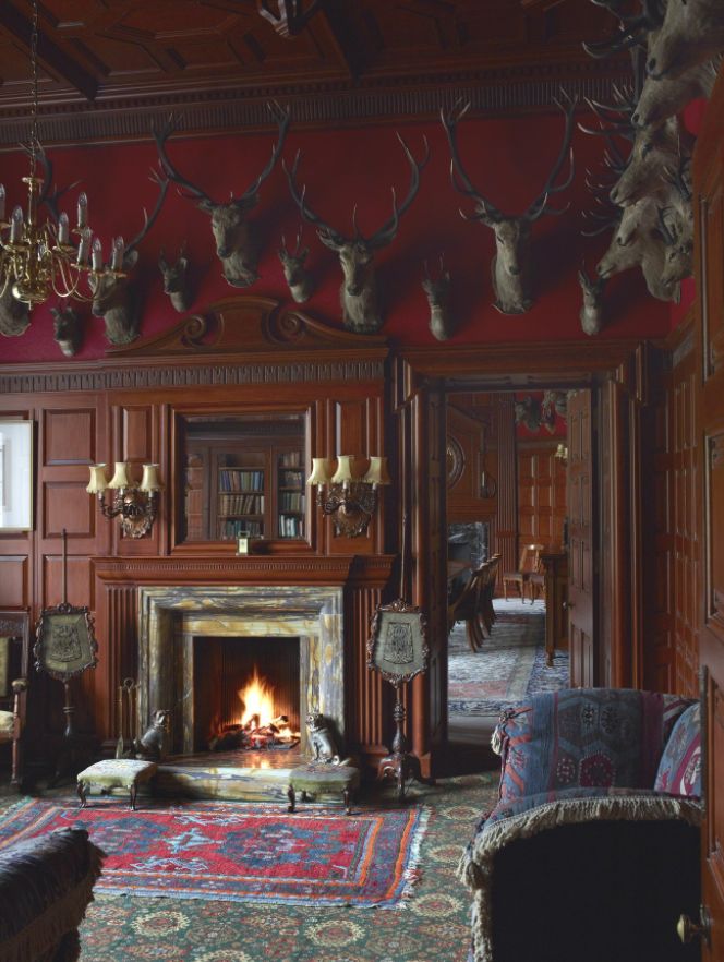 a living room filled with furniture and a fire place in the middle of a room