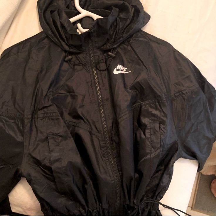 New Women’s Nike Wind Breaker Sporty Black Spring Outerwear, Sporty Black Outerwear For Spring, Trendy Hooded Nike Outerwear, Nike Black Outerwear For Spring, Nike Black Fall Outerwear, Nike Black Outerwear For Fall, Nike Black Outerwear For Work, Black Nike Outerwear For Work, Nike Outerwear For Spring Streetwear