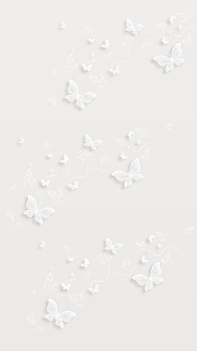 white butterflies flying in the air on a light gray background with space for your text