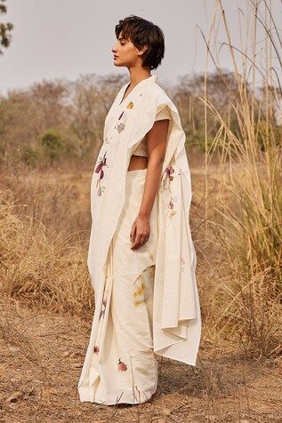 Off white saree featuring a floral print, crafted in cotton mul fabric. Paired with a schiffli embroidered blouse. - Aza Fashions Summer Designer Wear Floral Pre-draped Saree, Spring Cotton Silk Saree, Traditional White Pre-draped Saree With Floral Print, Traditional Drape Pre-draped Saree In Off White, White Traditional Drape For Spring, Spring Floral Print Saree, Summer Designer Chanderi Saree, White Floral Embroidered Chanderi Pre-draped Saree, Designer Saree For Summer With Traditional Drape