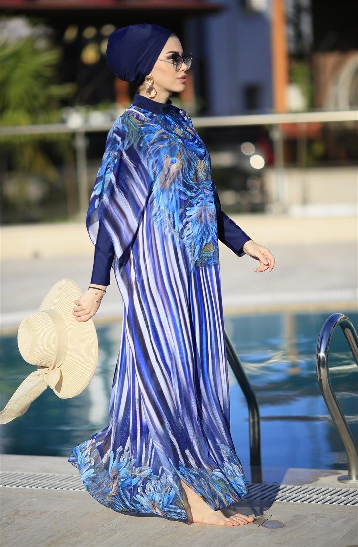 Ready to meet a modest elegance with a feminine look of purple, blue, floral patterns, and soft fabric? Our Burkini pareo caftan is designed to create a great combination with other burkini sets with its vivid and trendy look. Thanks to its soft and light texture, it will make you look perfect and reinforces your elegance when you are around the pool. Hey, especially Lycra Fabric Blue is a great option to combine with Phoenix Burkini! Blue Long Sleeve Swimwear For Beach Cover-up, Elegant Beach Abaya For Spring, Elegant Spring Beach Abaya, Elegant Long Sleeve Swimwear For The Beach, Blue Long Sleeve Dress For Poolside, Blue Long Sleeve Poolside Dress, Multicolor Summer Abaya For The Beach, Summer Multicolor Abaya For Beach, Multicolor Summer Beach Abaya