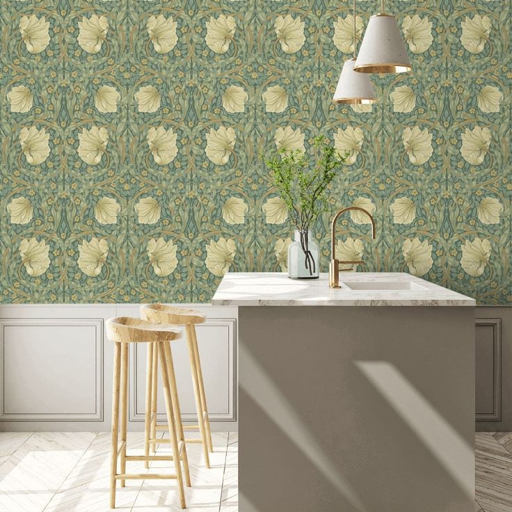 a kitchen with an island and stools in front of the wallpaper that has flowers on it