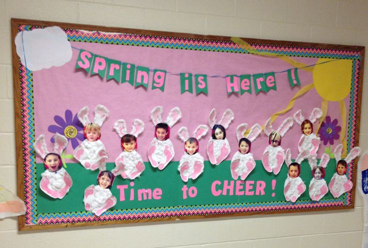 a bulletin board with pictures of children dressed up as easter bunnies and bunny ears