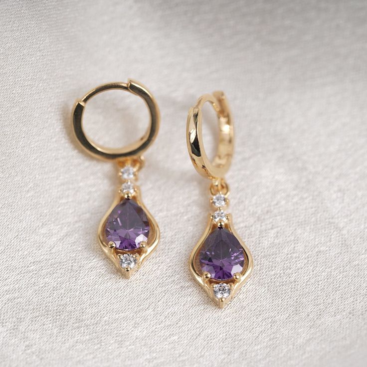 Pear Shape Amethyst  Diamond Drop Earrings, 14k Yellow Gold Plated Diamond Earrings, Women's Wedding Earrings, Amethyst Teardrop Earrings Material: High Quality Solid 925 Sterling Silver * Finish: Sterling Silver ∙ 14K Gold * I N F O R M A T I O N * Every item is tastefully wrapped and presented in lovely jewellery boxes. Reusable and biodegradable, our jewellery boxes * Are you interested in your own design or looking for advice? Do not hesitate to contact us! We take pride in our quick response times and are ready to help you. SHIPPING TIME * 3 TO 5 Business Days With USPS Priority Mail CHECKOUT OUR STORE FOR NEW EXCLUSIVE DESIGN: https://garnetcreationdesign.etsy.com Thank you immensely for choosing to visit our store, and we sincerely hope that your shopping experience with us surpasse Amethyst Drop Earrings, Elegant Gold Amethyst Hoop Earrings, Fine Jewelry Purple Drop Earrings, Purple Pierced Earrings For Wedding, Elegant Purple Amethyst Hoop Earrings, Elegant Amethyst Dangle Hoop Earrings, Elegant Purple Hoop Earrings As Gift, Elegant Purple Pierced Hoop Earrings, Elegant Purple Hoop Earrings For Gifts