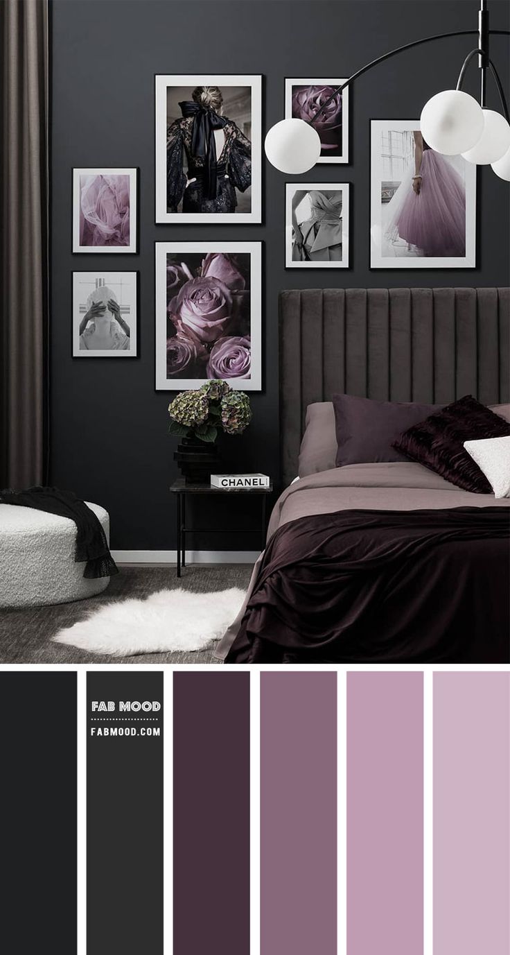 a bedroom with black and purple walls, pictures on the wall and a bed in it