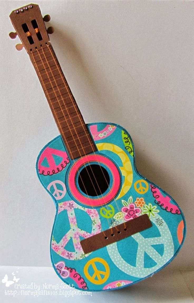 a blue guitar with peace signs on it