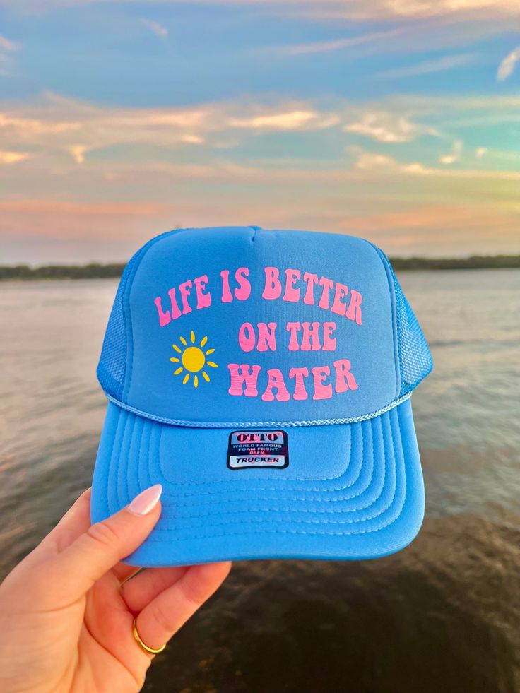 This adjustable OTTO trucker hat is so cute for summer time, it is adjustable and super comfy! It reads “Life is better on the water” in pink vinyl with a sunshine detail!! 🫶 Blue Trucker Hat, Ocean Inspired Jewelry, Custom Trucker Hats, Pink Vinyl, Hat Patches, Hat Ideas, Neat Ideas, Ocean Inspired, Jacksonville Fl