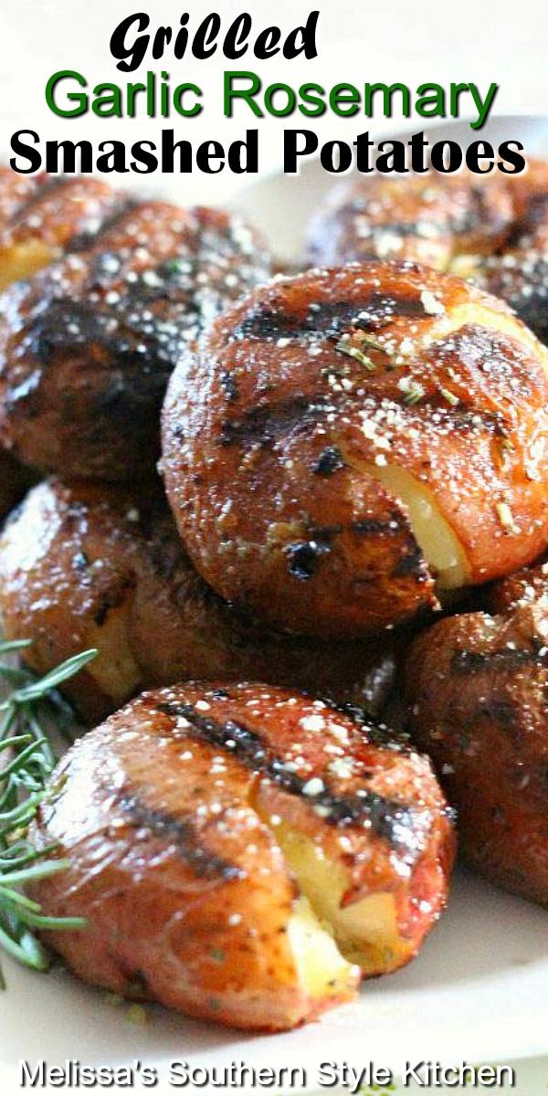 grilled garlic rosemary smashed potatoes on a white plate