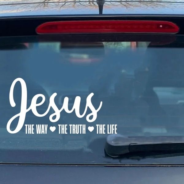 the back window of a car that says jesus, the way the truth the life