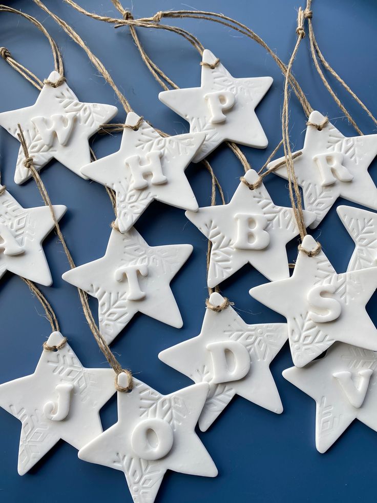 white ceramic christmas ornaments hanging from twine