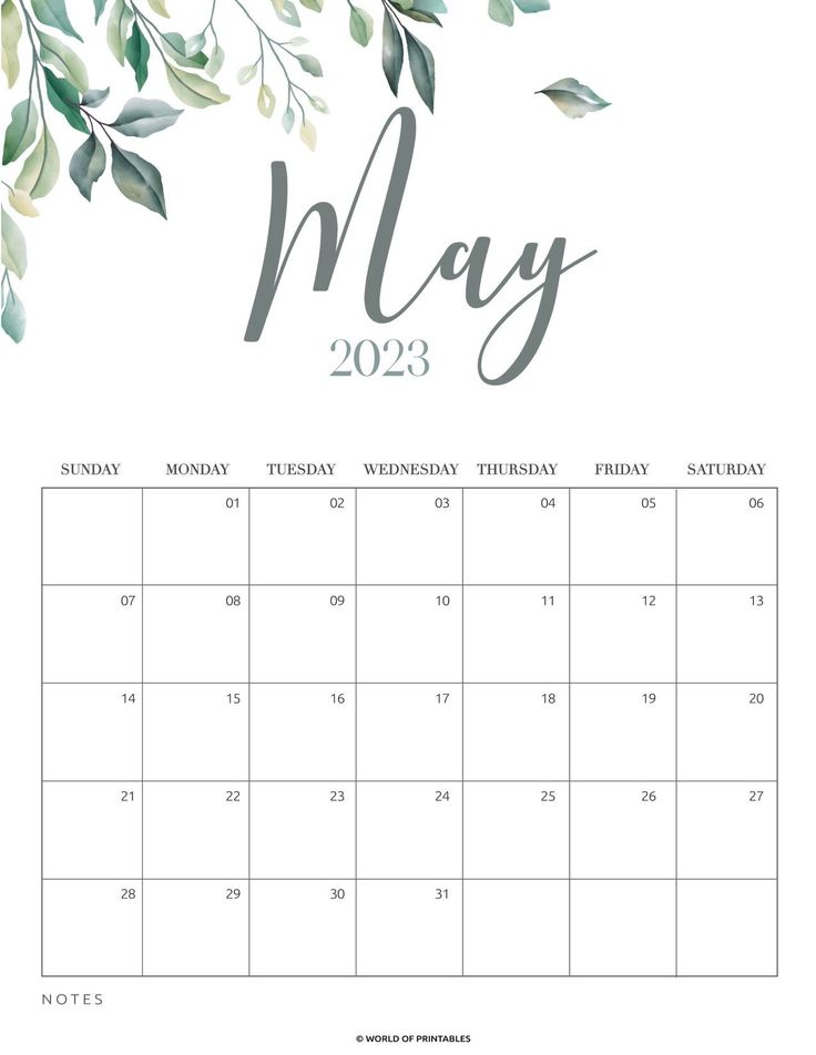 a calendar with the word may in grey and green leaves on white paper, next to a