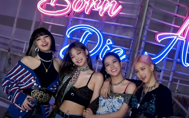 the girls are posing together in front of a neon sign that says happy qt4 day