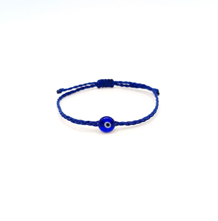 Blue evil eye Braided bracelet, Glass coin bead, Unisex, Adjustable, Good luck, All seeing, Devil eye, Protection amulet, Spiritual jewelry This simple yet beautifull bracelet is made using durable waxed string and has a glass bead evil eye in the middle. It is adjustable with a sliding knot closure. Other evil eye bracelets from my shop: https://www.etsy.com/shop/LuckyRatJewellery?section_id=14785936&ref=shopsection_leftnav_5 Other charm bracelets in my shop: https://www.etsy.com/shop/LuckyRatJ Rat Jewellery, Bead Evil Eye, Sliding Knot Closure, Eye Bracelets, Devil Eye, Protection Amulet, Minimalist Gifts, Braided Bracelet, Blue Evil Eye