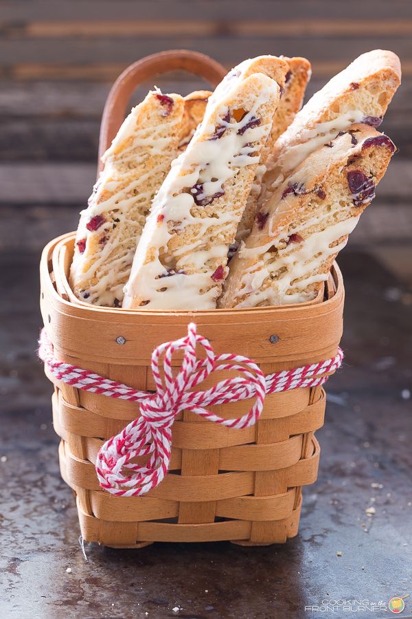 a basket filled with cranberry shortbreads on top of a table