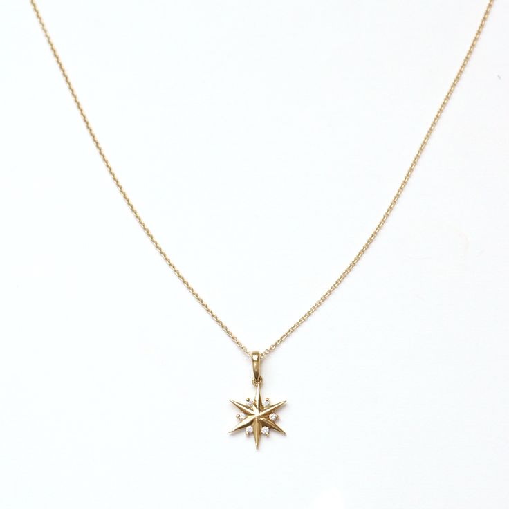 Shine bright with our 14K solid gold Diamond Star/Snowflake Necklace, featuring an 11.8mm radiant pendant adorned with 0.05 carats of near-colorless, SI1 clarity round brilliant-cut diamonds. Its versatile design resembles both a star and a delicate snowflake, adding a touch of celestial and wintry elegance. Suspended on a delicate chain with a total height of 17.5mm including the bail, this necklace is perfect for everyday wear or special occasions. Embrace the timeless beauty and unique charm Dainty Star-shaped Diamond Necklace For Gift, Dainty Star-shaped Diamond Necklace, Delicate 14k Gold Star Necklace, Dainty Star Diamond Necklace, Dainty Diamond Star Necklace, Fine Jewelry Yellow Gold Diamond Necklace With Star Charm, Yellow Gold Diamond Necklace With Star Charm, Star-shaped Necklace With Single Cut Diamonds For Gift, Star-shaped Single Cut Diamond Necklace Gift