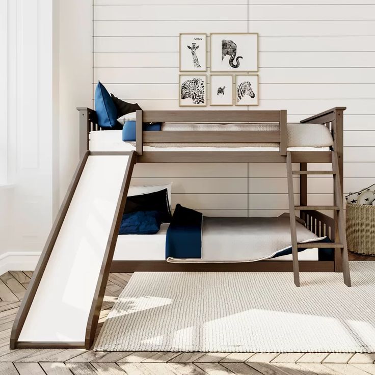 a bunk bed with a slide in front of it