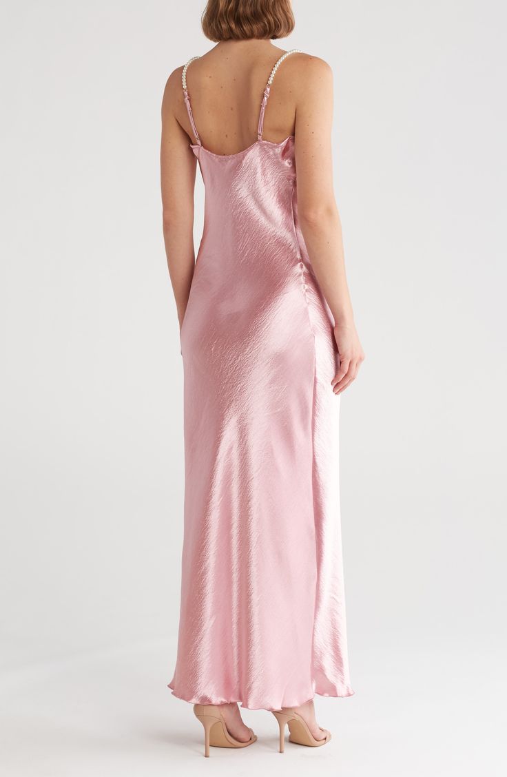 Imitation-pearl straps add to the luxe feel of a hammered-satin slipdress framed by a cowl neck and fluttery hem. 60" length (size Medium) 100% polyester Hand wash, line dry Made in the USA Elegant Pink Slip Dress With Delicate Straps, Feminine Slip Dress For Formal Occasions, Pink Satin Slip Dress For Prom, Pink Satin Slip Dress For Bridesmaid, Feminine Formal Slip Dress, Glamorous Pink Satin Slip Dress, Formal Slip Dress With Delicate Straps, Feminine Formal Satin Dress, Pink Slip Dress With Satin Finish And Spaghetti Straps