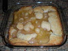 a glass casserole dish filled with food on top of a counter