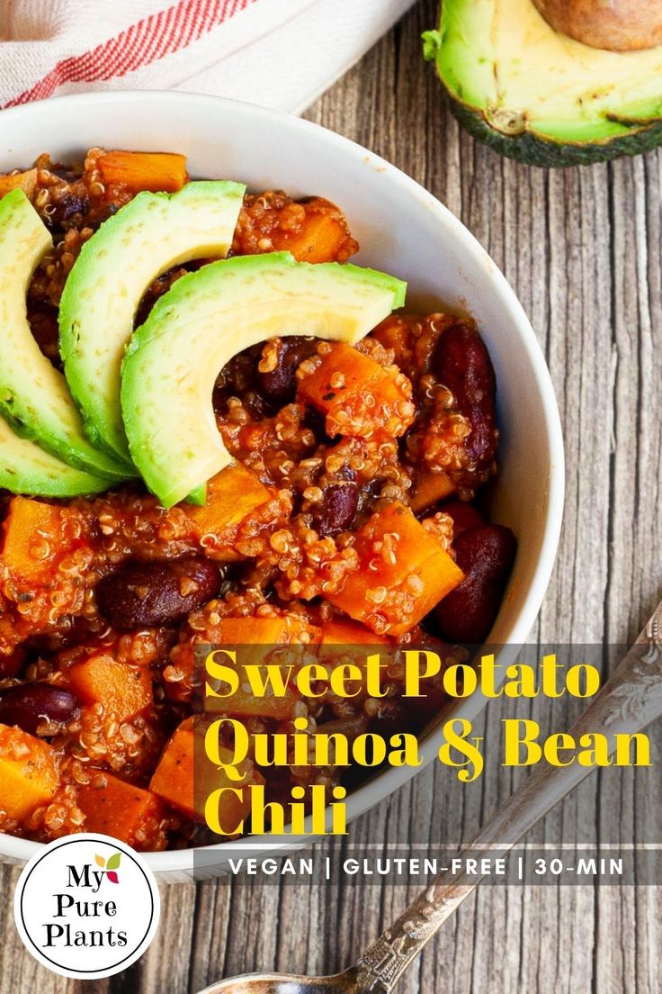 sweet potato quinoa and bean chili in a bowl with avocado on top