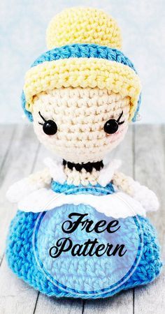 a small crocheted doll sitting on top of a blue object with the words free pattern