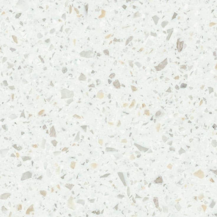 a white counter top with grey speckles on it