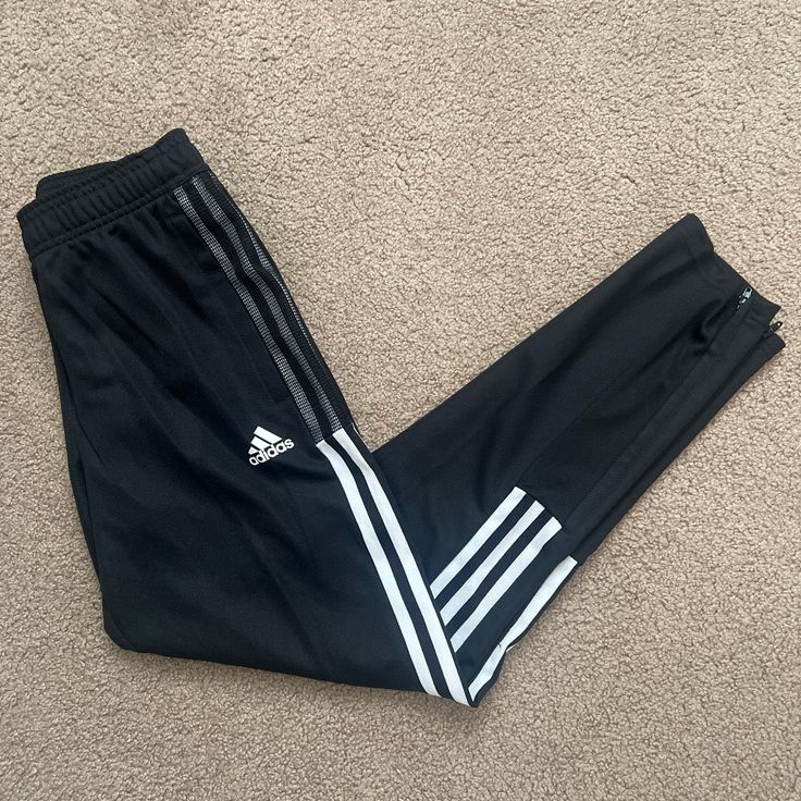 Never Worn Adidas Youth Joggers. Size 11/12. No Flaws. Perfect Condition Just Store Took Tags Off. Black With White Stripes. Functional Drawstring At Waist And Zippers On Bottom For Easy On Off With Cleats Adidas Bottoms, Adidas Joggers, Girly Accessories, Off Black, Adidas Black, Black Adidas, Kids Bottoms, White Stripe, Sweatpants