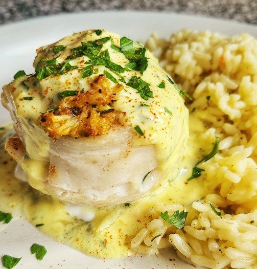 a white plate topped with chicken and rice