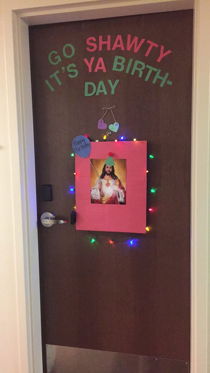 a door decorated with an image of a dog and christmas lights, says go shawty it's ya birth day