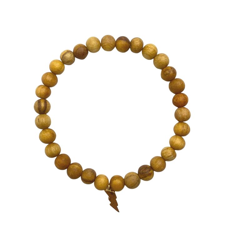 This stretchy bracelet is consciously handmade with Ethically Sourced Palo Santo beads from Peru (Brusera Graveolens), and a 18KT gold plated thunderbolt charm. Meaning: Palo Santo is an aromatic and sacred wood from Peru. Properties: Cleansing & therapeutic healing power. Inspired creativity & clears all negative energy. Chakra: Third eye Bracelet Diameter: 7 1/4" Wood Beads: 6mm Materials: Palo Santo Wood Beads / 18KT gold plated charm over sterling silver. Our beads and Palo Santo sti Aura Healing, Palo Santo Wood, Healing Power, Eye Bracelet, Stretchy Bracelets, Healing Powers, Negative Energy, Different Shapes, Third Eye