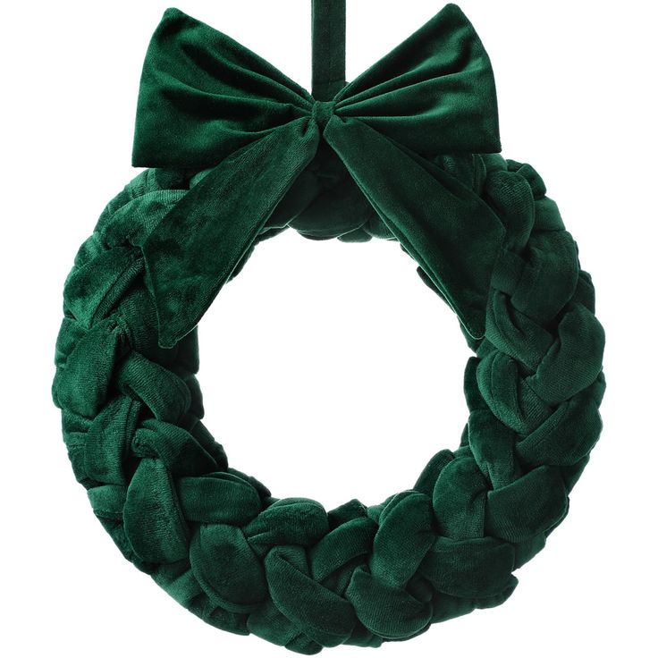 a green wreath with a bow on it