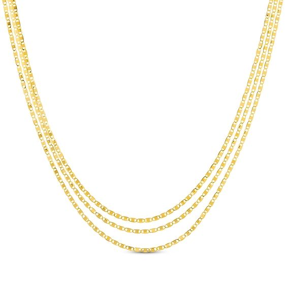 Dress to impress with this three-strand solid Valentino chain necklace. Crafted in 14K yellow gold Three lengths of Valentino chain create a layered look Chain width is 1.25mm With 18-inch, 18.5-inch and 19-inch lengths, the adjustable necklace secures with a lobster clasp Yellow Gold Clavicle Chain Jewelry For Valentine's Day, Yellow Gold Clavicle Chain Necklace For Valentine's Day, Valentine's Day Yellow Gold Box Chain Necklace, Everyday Luxury Tarnish-resistant Yellow Gold Chain Necklace, Valentine’s Day Yellow Gold Plated Chain Necklace, Accessories Jewelry Necklace, Adjustable Necklace, Layered Look, Apparel Accessories