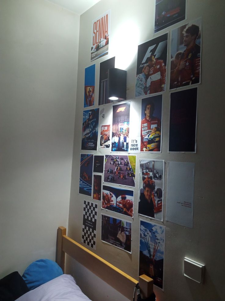 a bedroom with posters on the wall and a bed