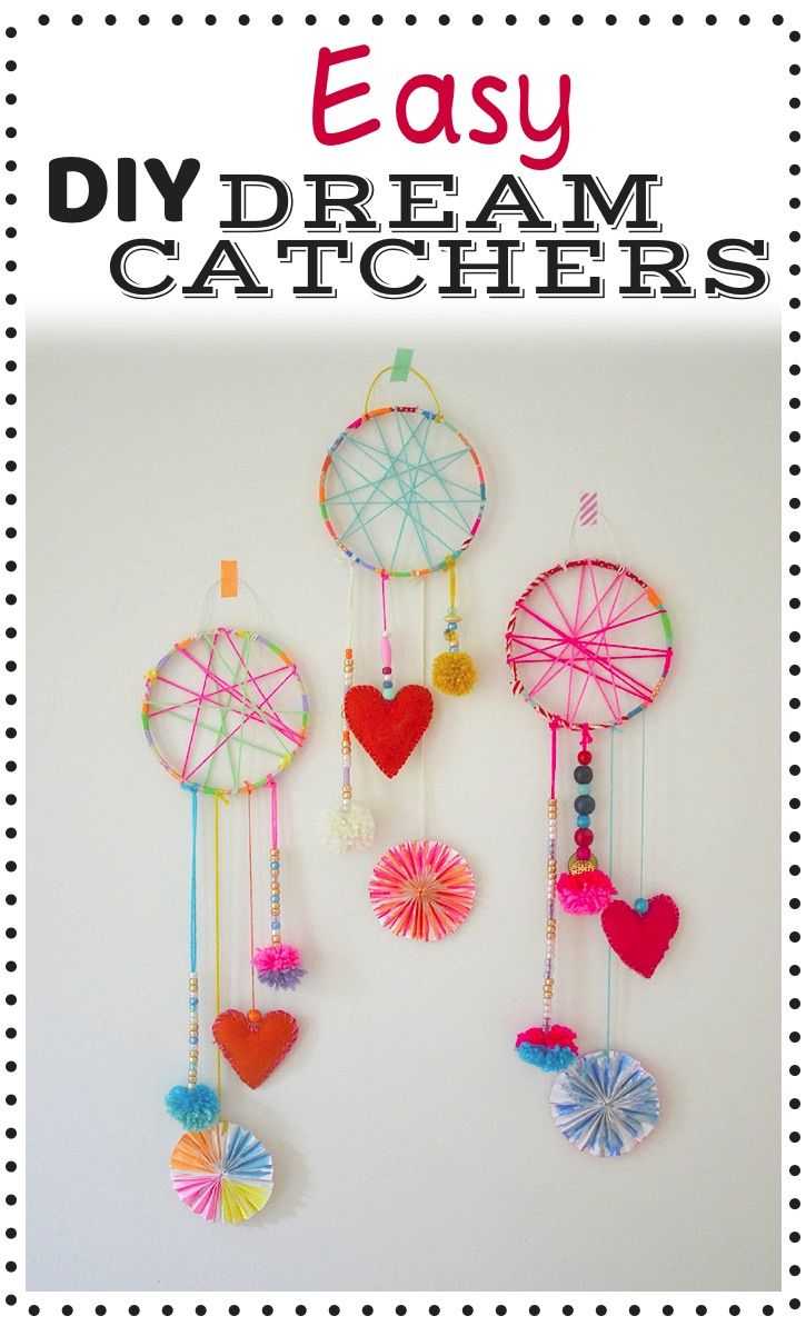 the easy diy dream catchers are made with yarn, paper and plastic hearts