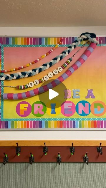 a colorful bulletin board with the words friends hanging from it's sides and hooks on the wall