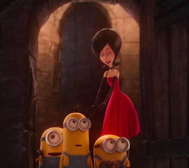 a woman in a red dress standing next to two minion characters