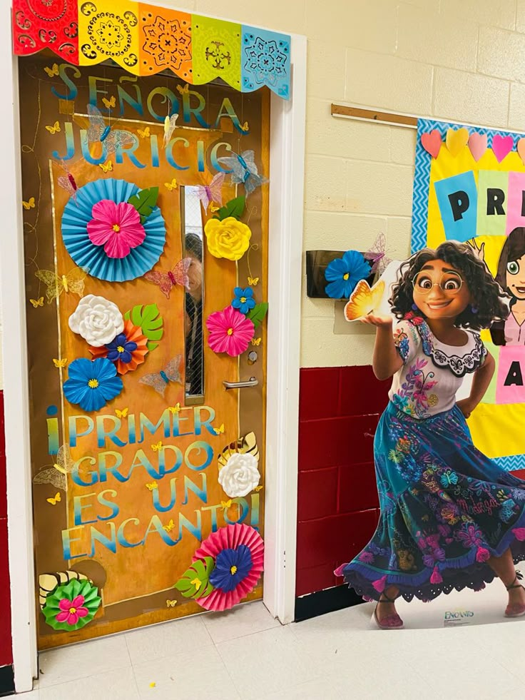 the door to dora's school is decorated with paper flowers and decorations for her birthday