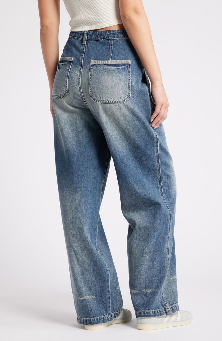 These baggy, high-waist jeans are designed with edgy rips, stitching detail and dramatic wide legs. 31" inseam; 22" leg opening; 13 1/2" front rise; 17" back rise (size 29) Zip fly with button closure 70% cotton, 30% Tencel® lyocell Tencel lyocell is a more-sustainably produced fiber made with closed-loop processing Machine wash, tumble dry Five-pocket style Imported Spring Utility Wide Leg Flare Jeans, Distressed Relaxed Fit Pants For Fall, Relaxed Fit Medium Wash Wide-leg Cropped Jeans, Oversized High Waist Medium Wash Jeans, Oversized High-waist Medium Wash Jeans, Relaxed Fit Wide-leg Cropped Jeans In Medium Wash, Distressed Baggy Flare Jeans For Fall, Relaxed Fit Distressed Pants For Fall, Spring High Rise Distressed Cargo Jeans