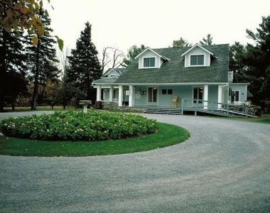 a house with a driveway in front of it