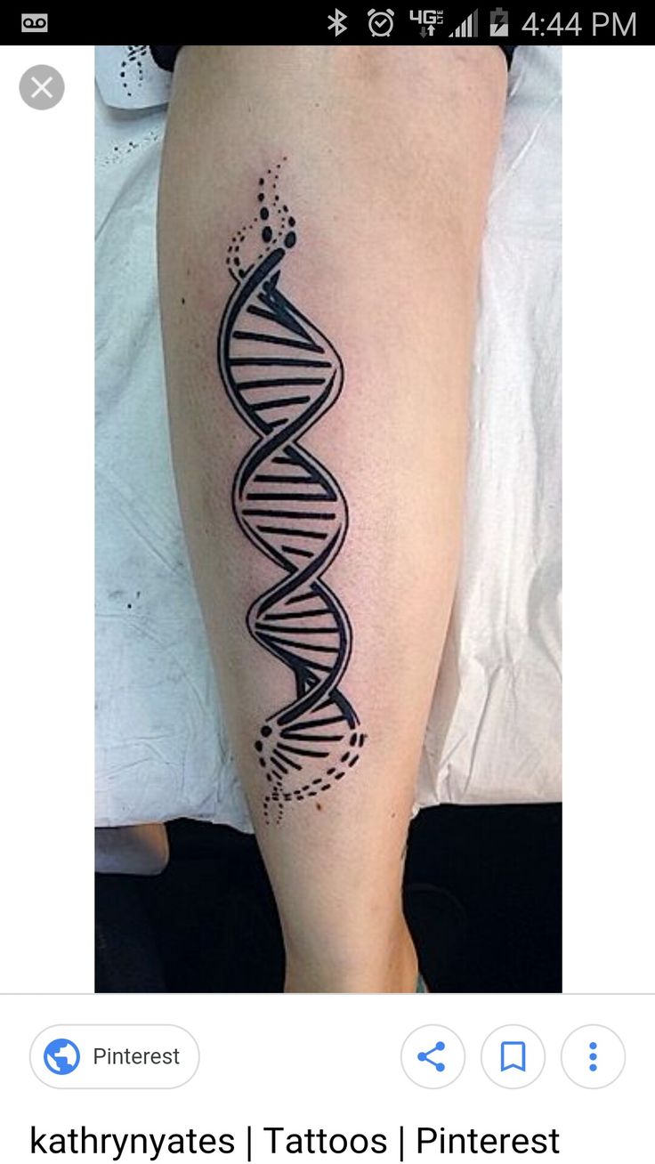 a tattoo on the leg of a person with a black and white image of a double strand