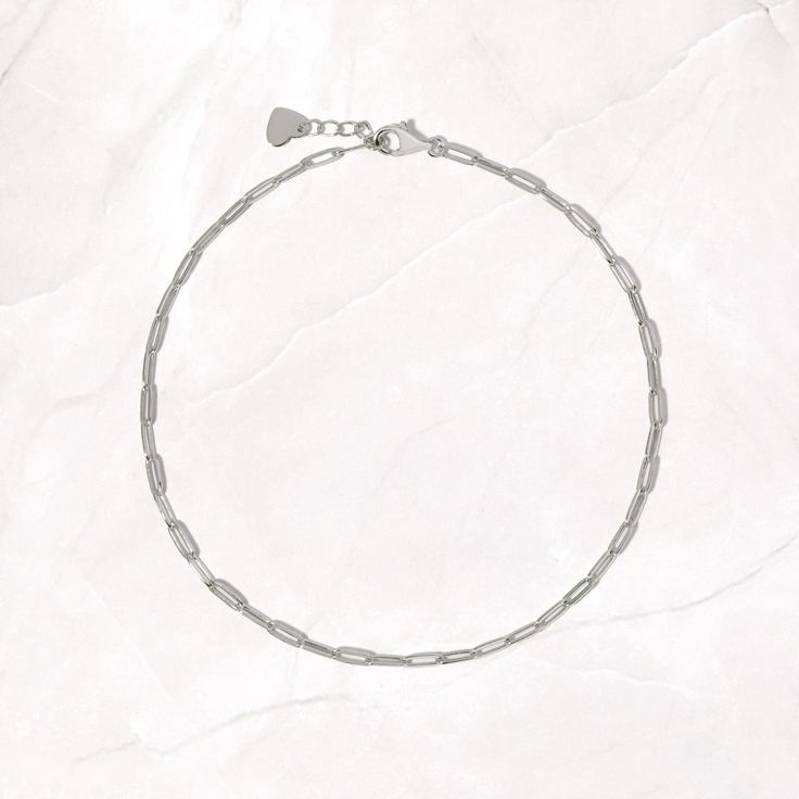 Cute and dainty paperclip chain anklet. Perfect for a minimalist and casual look, or stacked with another anklet. Made of 925 Sterling Silver We use a THICK plating of 14k Gold or Rhodium Available in 9" or 10" + .5" Extension Chain Nickel-Free and Hypoallergenic Lobster Clasp Closure Chain Anklet, Recycled Metal, Paper Clip, Free Giveaway, Precious Metals, Timeless Pieces, Anklets, Lobster Clasp, Casual Looks