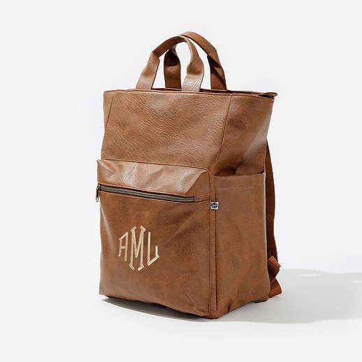 Keep up with all of your essentials with this spacious and cute Monogrammed Commuter Backpack Purse! This Personalized Backpack is a great way to keep all of your items in one place.This roomy bookbag lets you carry it all - and features a front pocket, two side pockets, two inner pockets, and a laptop pocket. For valuables or easy access, you'll love the front zippered pocket that features your choice of monogram. Use our exclusive monogram preview tool to see what your finished personalized la School Laptop Bag With Luggage Sleeve, School Laptop Bag Backpack With Luggage Sleeve, Everyday Laptop Bag For Back To School, Back To School Rectangular Backpack For On-the-go, School Tote Backpack With Zipper Pocket, School Backpack Satchel With Luggage Sleeve, Back To School Backpack Diaper Bag For Everyday Use, Back To School Diaper Backpack, Back To School Diaper Backpack For Everyday Use