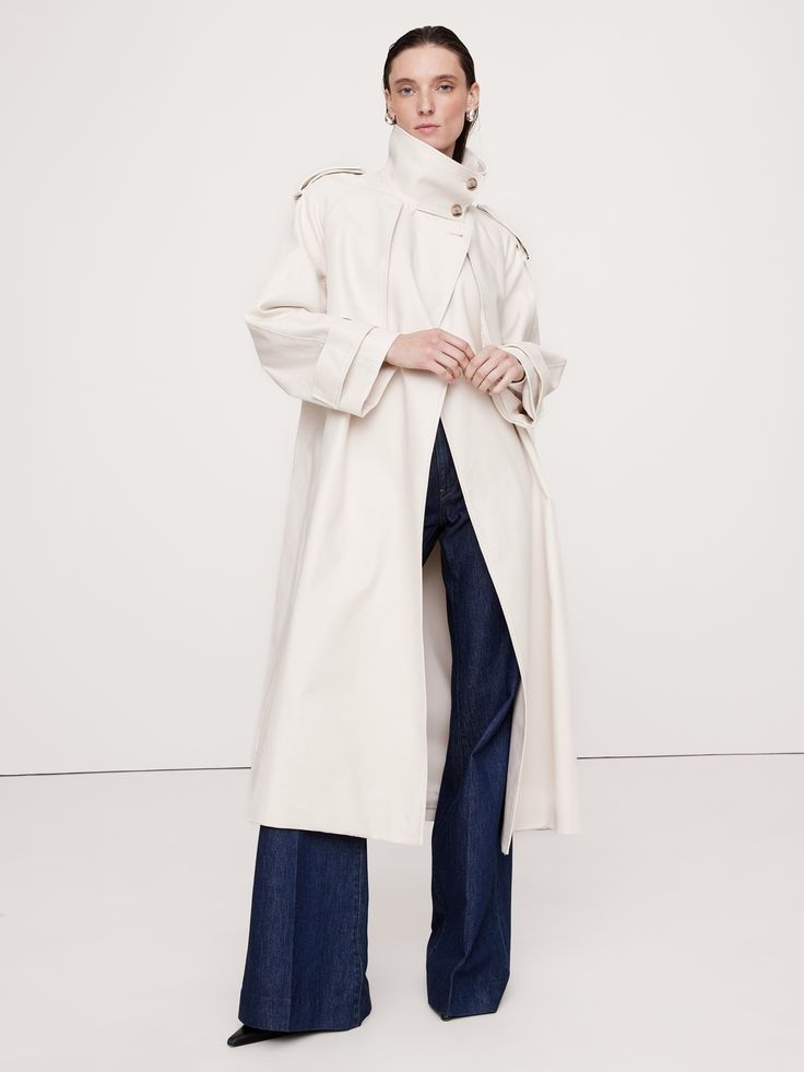 An ode to the best utility styles in our archives, this trench coat is cut from a cotton twill we sourced from Italy, one we love for its dressed-up appearance.  Here, we cut it in an oversized fit with classic trench coat details like a shoulder epaulets and storm flaps.  Warm: Lightly lined through the body for easy layering through the seasons.  Oversized fit with dropped shoulder and wide sleeves.  Fabric from Italy's Olimpias mill.  Stand collar with button front and belted closure.  Interi Coat Details, Outerwear Trends, Coat Trends, Classic Trench Coat, Maxi Coat, Suede Coat, Shearling Coat, Wide Sleeves, Stylish Fashion