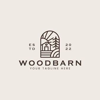 the logo for wood barn is shown in black and white, with an image of trees on