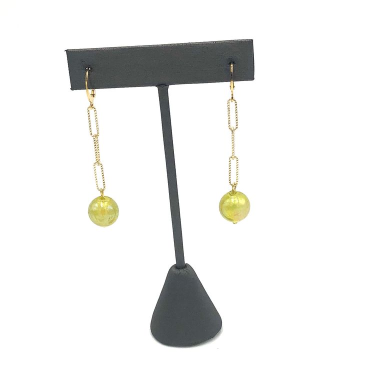 Introducing our Chartreuse Aurora Chain Cuff Earrings – the perfect combination of style and sophistication. These unique earrings feature a vibrant chartreuse bead and a sleek cuff design. Elevate any outfit and make a statement with these must-have accessories. Earrings measure 2 3/8" long and 1/2" wide. Hypoallergenic gold plated leverback cuff style earwires. Earrings are made with vintage lucite parts that were made in Rhode Island in the 1960's - early 80's by Best Plastics. Elegant Beaded Chain Drop Earrings, Elegant Beaded Chain Earrings, Green Linear Earrings For Parties, Chic Beaded Chain Jewelry For Formal Occasions, Chic Formal Beaded Chain Jewelry, Metal Drop Earrings With Beaded Chain, Elegant Adjustable Beaded Earrings With Beaded Chain, Elegant Beaded Chain Earrings For Party, Elegant Adjustable Beaded Earrings